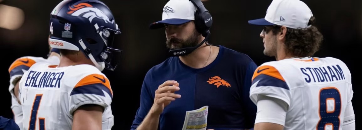 Davis Webb coaching quarterbacks on the Denver Broncos sideline